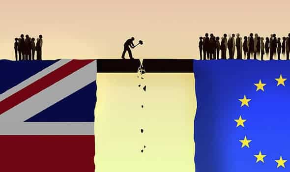 British and eu flags with people standing on the edge of a cliff.