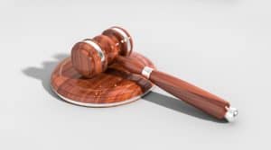 A wooden gavel on a white background.