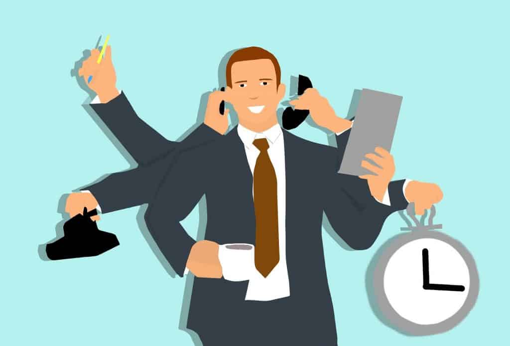 A businessman holding a phone, a clock, and a clock.