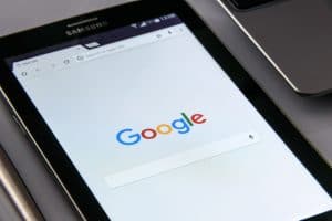 The google logo is displayed on a cell phone.